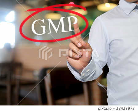 Hand of man touching text GMP with white color. 28423972