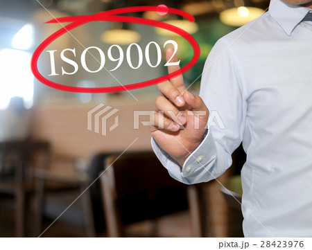 Hand of man touching text ISO9002 with white color Hand of man touching text ISO9002 with white color 28423976