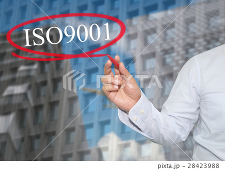 Hand of young businessman write the word ISO 9001 28423988