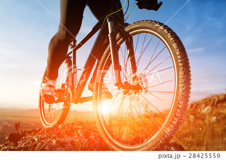 Closeup of cyclist man legs riding mountain bike 28425559