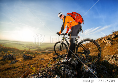 Cyclist in helmet and glasses on mountain bike Cyclist in helmet and glasses on mountain bike 28425704