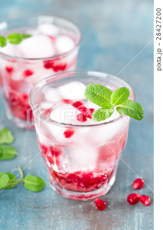 Infused water made of fresh pomegranate with ice Infused water made of fresh pomegranate with ice 28427200