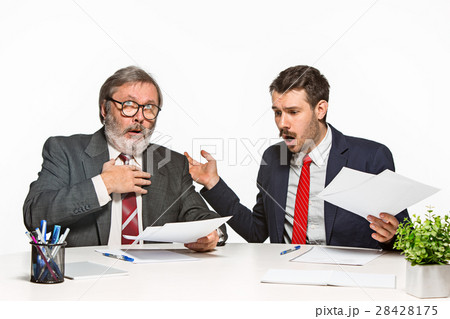 The two colleagues working together at office on The two colleagues working together at office on 28428175