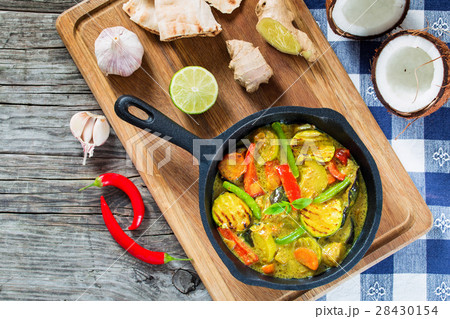 curry with vegetables stewed in a frying pan curry with vegetables stewed in a frying pan 28430154