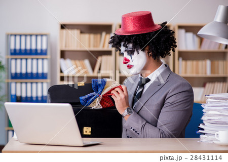 The clown businessman working in the office 28431114