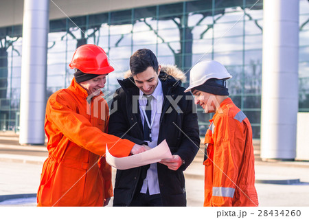 boss instructs young team of young engineers boss instructs young team of young engineers 28434260