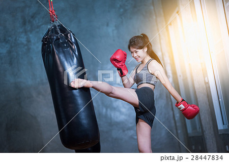 sexy asia girl punching boxing bag 28447834