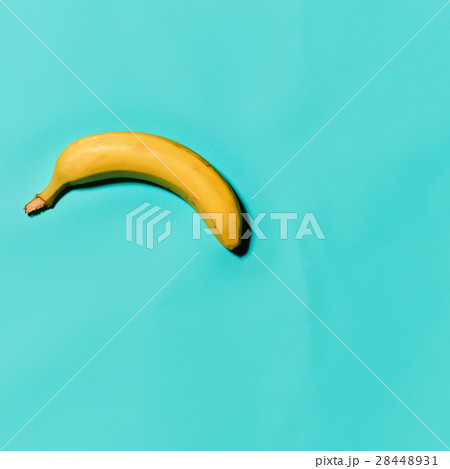 Single banana against blue background 28448931