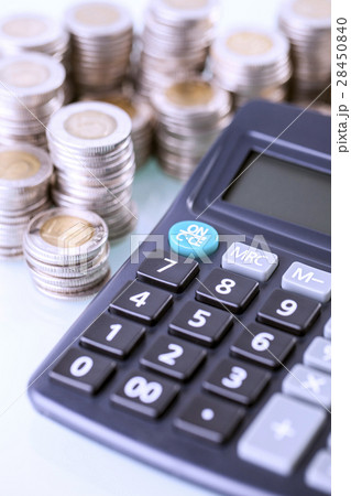Couns and calculator on white background 28450840