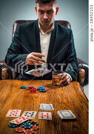 The man, chips for gamblings, drink and playing The man, chips for gamblings, drink and playing 28452153