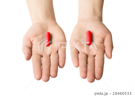 Man hands giving two big red pills.  28460533
