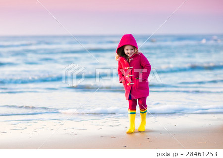 Child on North Sea beach in winter 28461253