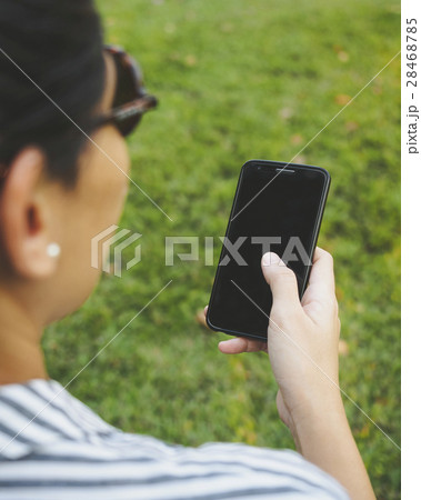 Woman Hand holding Mobile Smart phone outdoor Woman Hand holding Mobile Smart phone outdoor 28468785