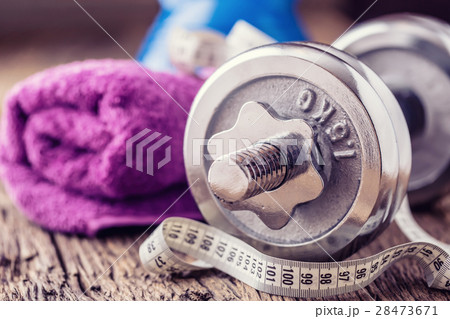 Kettlebell dumbbell towel water and measuring tape 28473671
