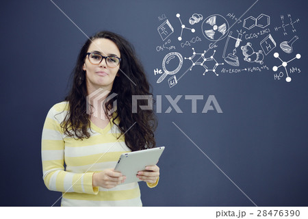 Woman with tablet in front of background with 28476390