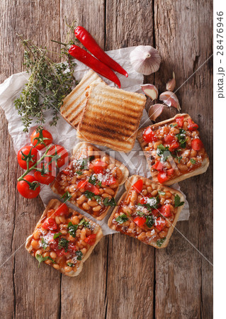 Tasty sandwich with white beans, tomatoes, cheese Tasty sandwich with white beans, tomatoes, cheese 28476946