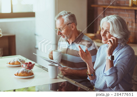 Positive aged couple having breakfast in the Positive aged couple having breakfast in the 28477651