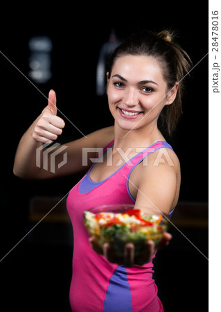 healthy young woman eating vegetables green salad 28478016