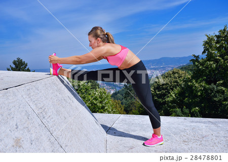 healthy young pretty woman stretching her leg 28478801
