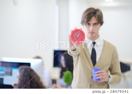 young angry businessman pointing his watch as 28479341