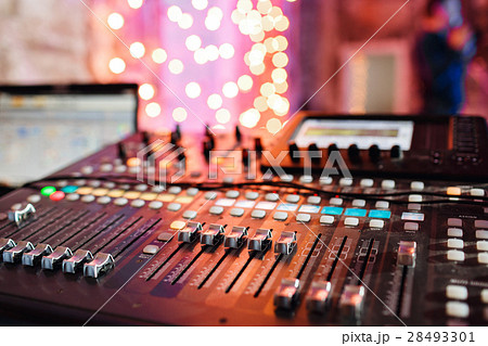 od adjusters and red buttons of a mixing console 28493301