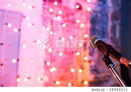 Close up of microphone in concert hall with Close up of microphone in concert hall with 28493311