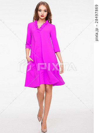 Young beautiful fashion model wearing purple dress 28497869