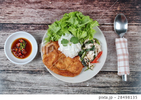 Rice topped stir-fried spicy basil with crab . Rice topped stir-fried spicy basil with crab . 28498135