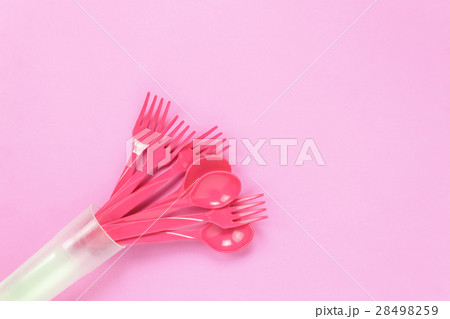 Top view colorful plastic spoon on pink table Top view colorful plastic spoon on pink table 28498259