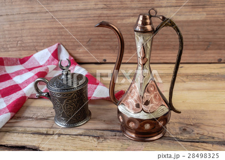 Turkish teapot with metal cup and 28498325