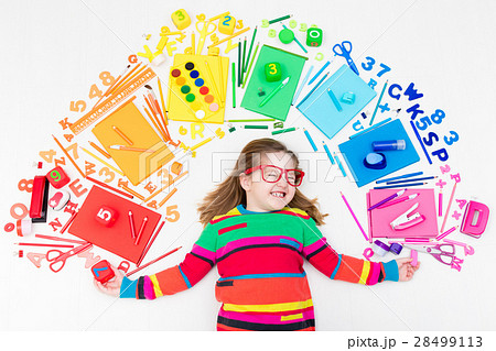 Child with school and drawing supplies 28499113