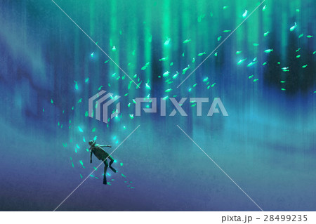diver and many glowing fish under the sea 28499235