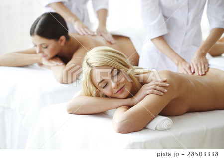 Two women getting massage Two women getting massage 28503338