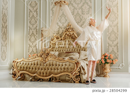 Elegant mature lady waking up at home 28504299
