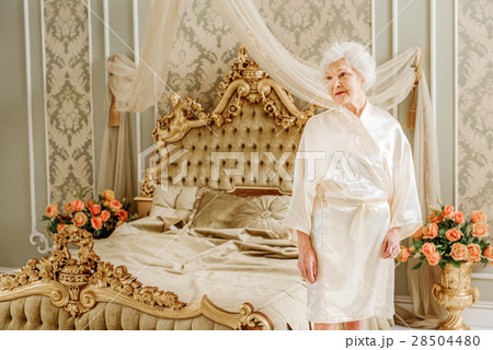 Rich old woman is lovely in her apartment Rich old woman is lovely in her apartment 28504480