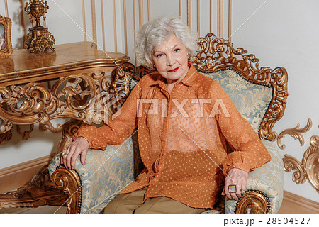 Serious mature woman gazing someone 28504527