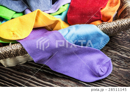 different color textile socks in the basket  28511145