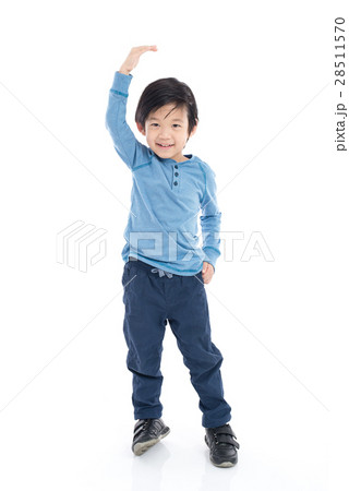 Asian Boy growing tall and measuring himself 28511570