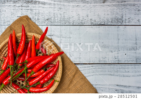 Hot and spicy red chilli on wood table background 28512501