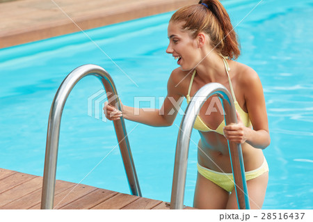 attractive young woman in pool, hot summer day, shot from above attractive young woman in pool, hot summer day, shot from above 28516437