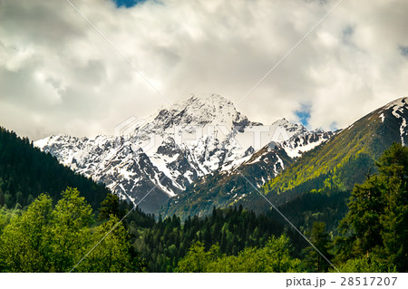 mountain peaks against the blue sky 28517207