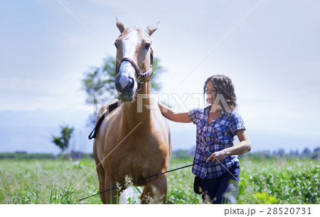 Woman training her horse 28520731