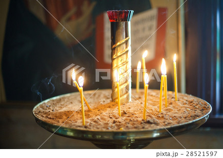 The candle flame in orthodox church, close up 28521597