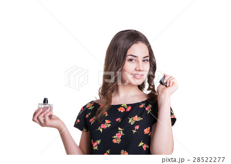 young woman enjoying a smell of the perfume 28522277