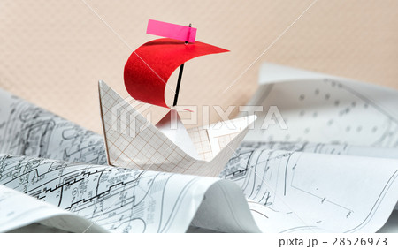 paper boat floating on the paper waves 28526973