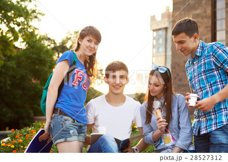 Students or teenagers with notebooks outdoors 28527312