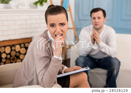 Pretty nervous woman biting her pen 28528129