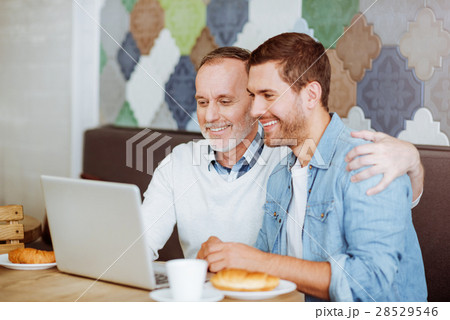 Positive aged man and his grandson resting in the 28529546