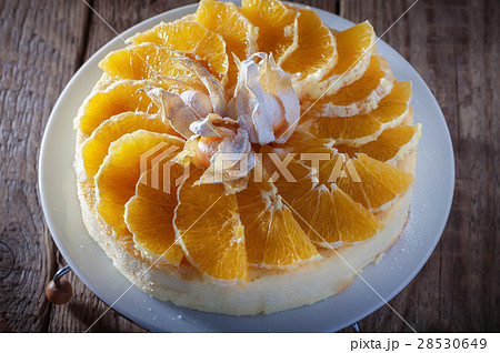 Cheesecake decorated with oranges and physalis Cheesecake decorated with oranges and physalis 28530649