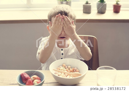 Little Boy Enjoying Bowl Of Cereal Little Boy Enjoying Bowl Of Cereal 28538172
